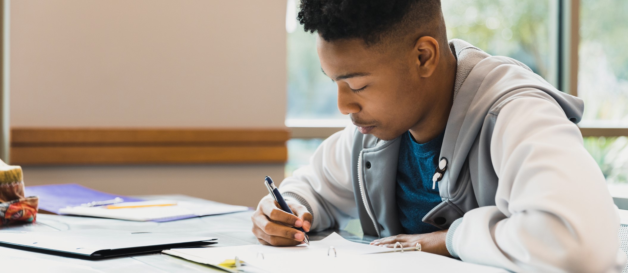 Child writing at desk