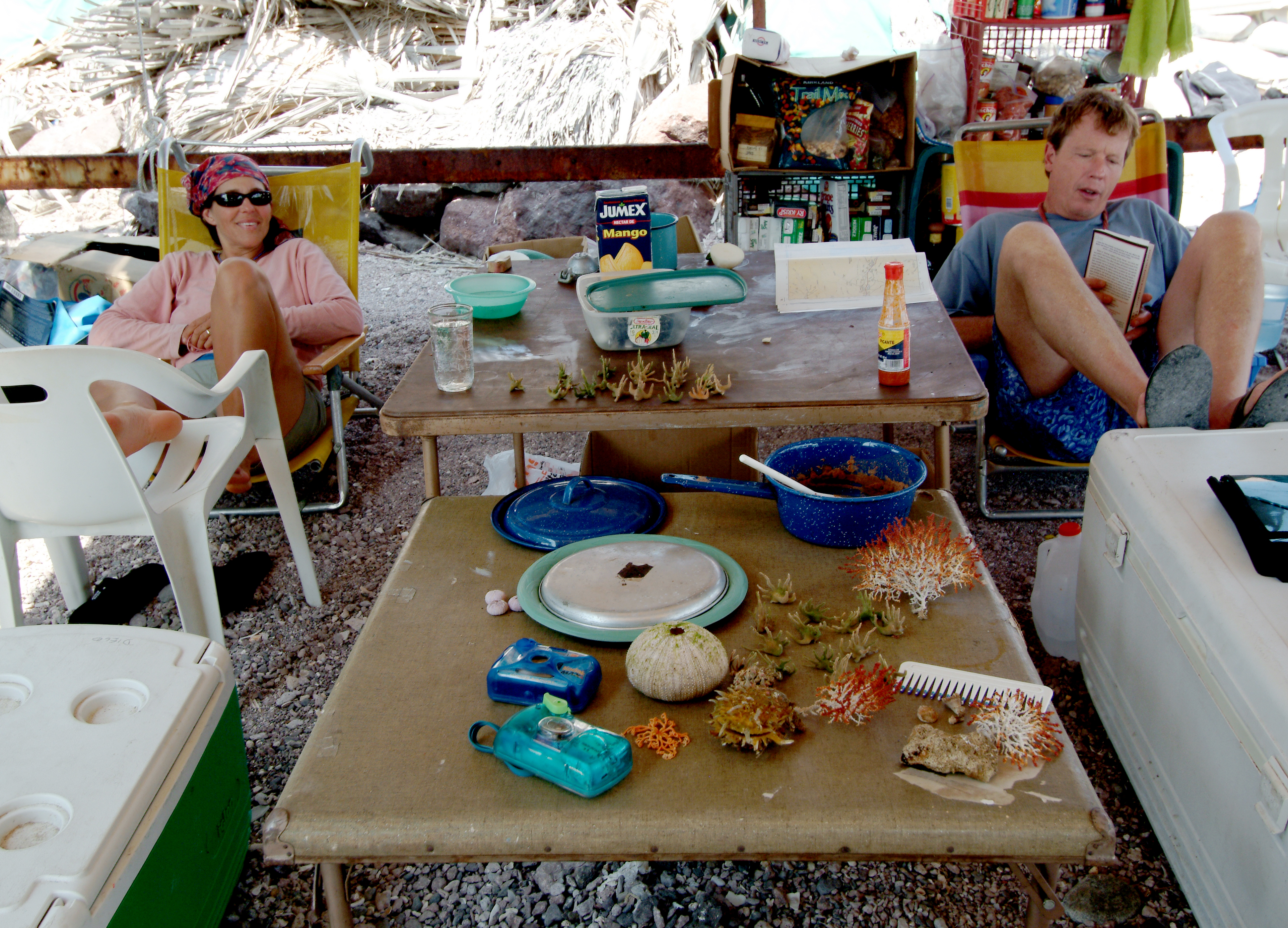 We set up camp on the beach using a large tarp to create a comfortable living space. Then we slept in tents on the beach.